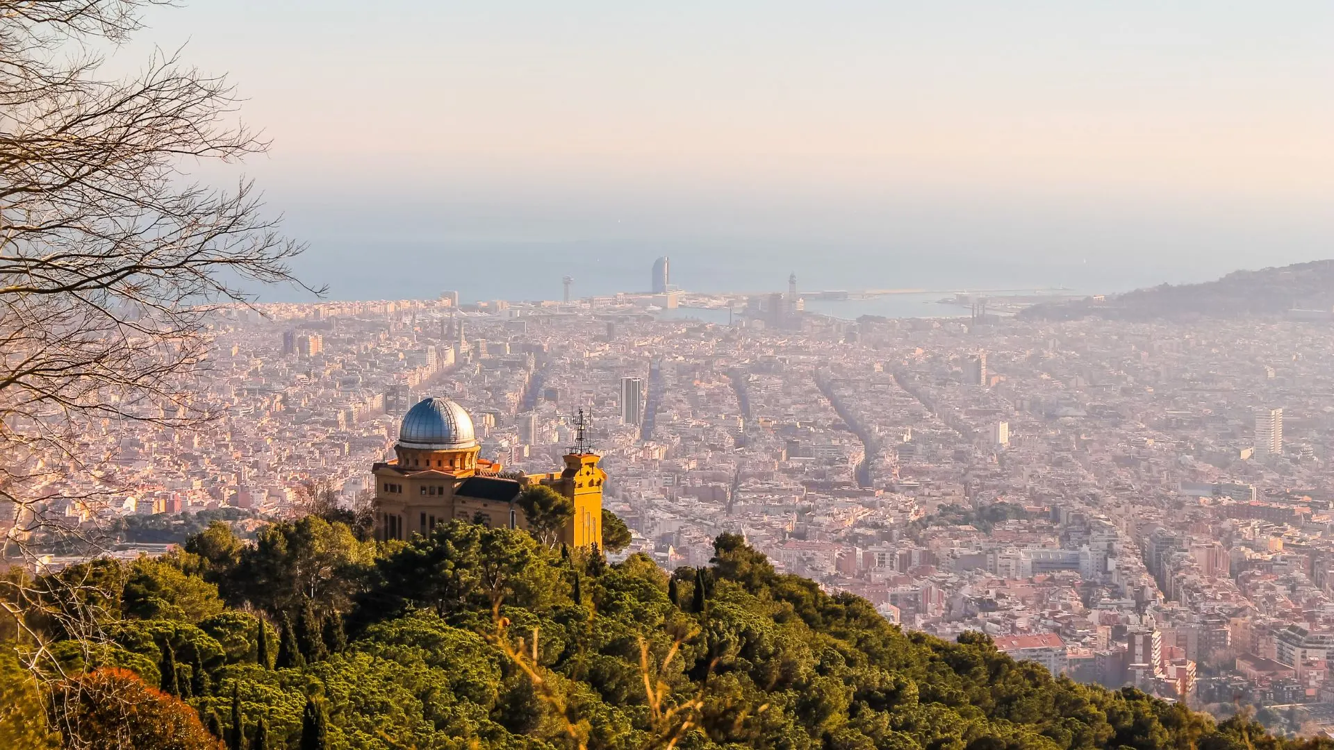 Daytime panoramic view of Barcelona from the Tibidabo hillside